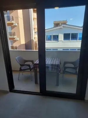 a view of a balcony with a table and chairs at Top Apartments in Dobra Voda
