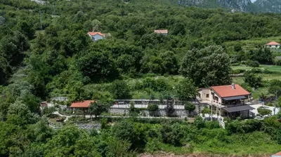 an aerial view of a house on a hill at Guest House Vrelo in Virpazar