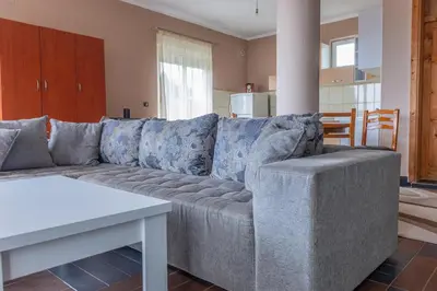 a living room with a couch and a table at Nomad apartments in Ulcinj