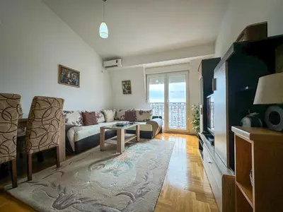 a living room with a couch and a table at Apartment 50 in Podgorica