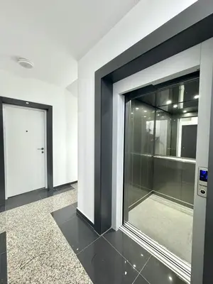 a room with a large glass window and a door at Modern One bedroom Apartment Budva in Budva