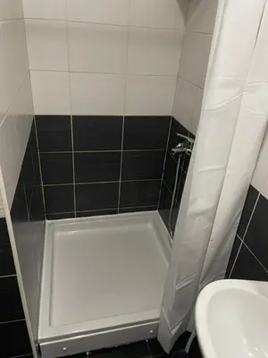 a bathroom with a bath tub and a sink at Royal in Podgorica
