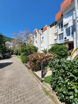 a cobblestone street next to a building at Apartman Budva 1 in Budva