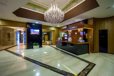 a lobby with a chandelier in a building at Luxury Apartment Anastasia Tre canne in Budva