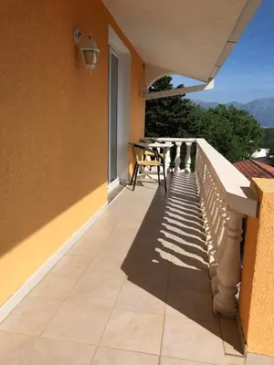 a balcony with a table and a view at Vila Bronhi in Sutomore