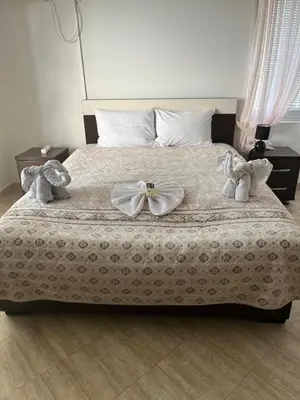 a bed with two stuffed animals on top of it at Vila Bronhi in Sutomore