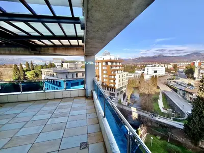 a balcony with a view of a city at Central Rusitc Apartment in Podgorica