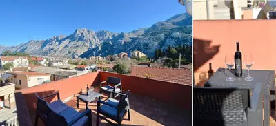 a balcony with a table and chairs and a mountain at the Right Choice Apartment in Kotor