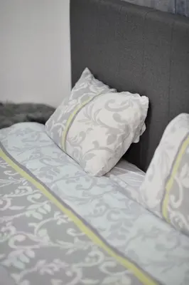 a close up of a bed with a pillow at the Right Choice Apartment in Kotor