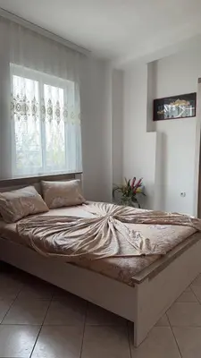 a large bed in a room with a window at Sea in Ulcinj