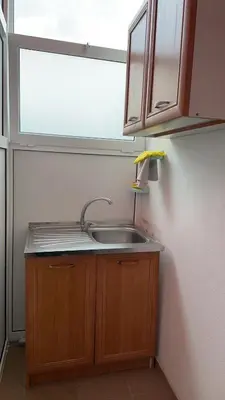 a kitchen with a sink and a window at Sea in Ulcinj