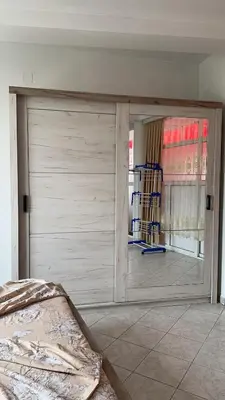a bedroom with a sliding door in a room at Sea in Ulcinj
