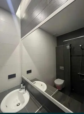 a bathroom with a sink and a toilet at Beach Pearl in Sutomore