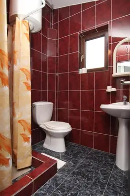 a bathroom with a toilet and a sink at Apartmani Dresic in Sutomore