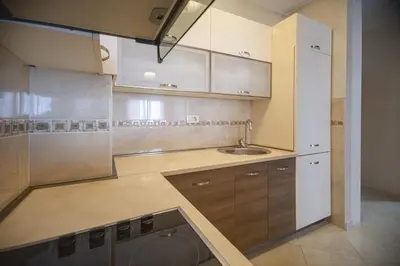 a kitchen with a sink and a washing machine at Vista Suite in Budva