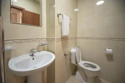 a bathroom with a sink and a toilet at Vista Suite in Budva