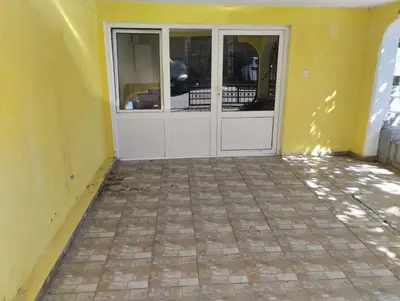 a door in a yellow room with a tile floor at Summer Paradise, Bar in Bar