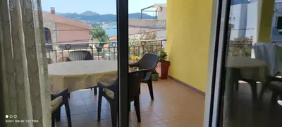 a balcony with a table and chairs and a view at Summer Paradise, Bar in Bar