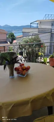 a bowl of fruit on a table on a balcony at Summer Paradise, Bar in Bar