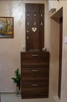 a dresser in a room with a chest of drawers at Apartmani Milica Mica Kotor Dobrota in Kotor