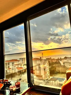 a view of a city from a window at Apartman Gold.HD in Dobra Voda
