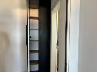 a room with a mirror and a closet at Apartman Gold.HD in Dobra Voda
