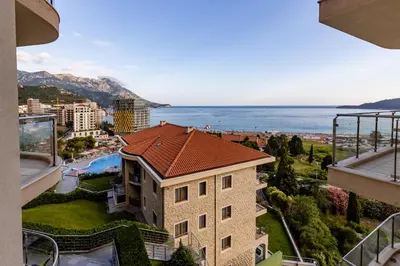 a view of the ocean from a building at Apartman DELUXE in Budva