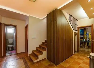 a hallway with a staircase in a house at Gala’s Miracle Garden in Budva
