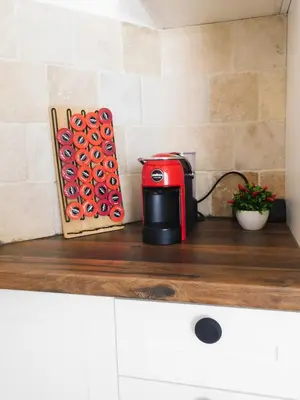 a red toaster sitting on top of a counter at Casa Oliva Villa A with heating pool in Budva