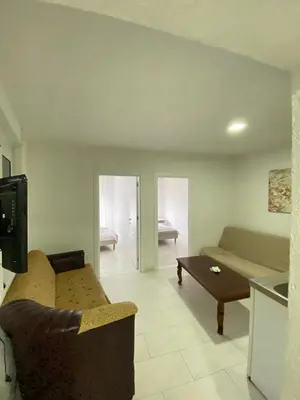 a living room with a couch and a table at Blue Dream in Ulcinj