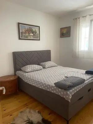 a bedroom with a bed in a room at Njegusi-Cetinje in Njeguši