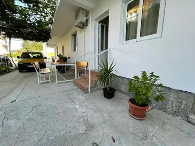 a porch of a house with a table and chairs at Apartments Pericic LUX in Sutomore