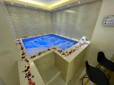 a jacuzzi tub in a hotel room with at Apartments Pericic LUX in Sutomore