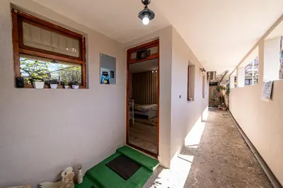 a hallway with a green floor in a house at Old Street in Podgorica
