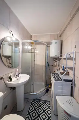 a bathroom with a shower and a sink and a toilet at Old Street in Podgorica