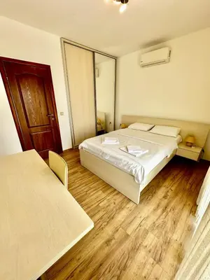 a hotel room with a bed and a mirror at Villa Sun in Kotor