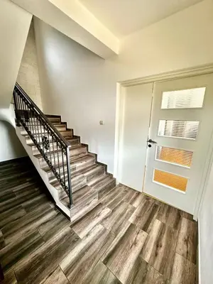 a staircase in a house with wooden floors at Villa Sun in Kotor