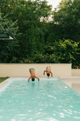 a toy dog on wheels in a swimming pool at Auto camp Matica in Podgorica