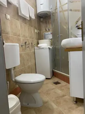 a bathroom with a toilet and a sink at Stan Stari Grad Budva in Budva