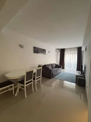 a living room with a table and a couch at Stan-apartman, Apartment, квартира in Bar