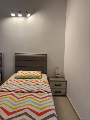 a bedroom with a bed and a night stand at Stan-apartman, Apartment, квартира in Bar