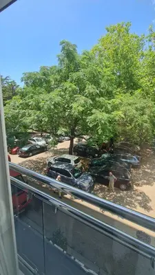 a view of cars parked in a parking lot at Stan-apartman, Apartment, квартира in Bar