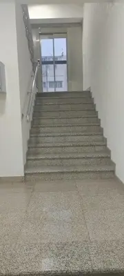 a stairway in a building with a stair case at Stan-apartman, Apartment, квартира in Bar