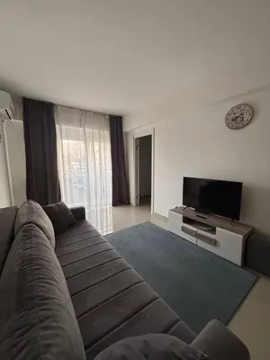 a living room with a couch and a flat screen tv at Stan-apartman, Apartment, квартира in Bar