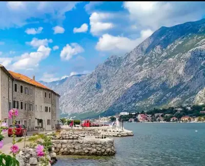 a view of a lake with mountains in the background at Iva apartment in Kotor