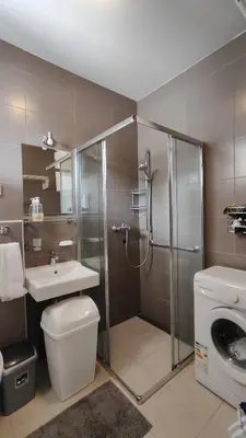 a bathroom with a shower and a toilet and a sink at Apartment Pržno in Pržno