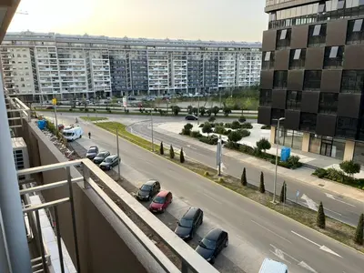 a view of a street with cars parked in a parking lot at White Homes 105 - Central Point in Podgorica