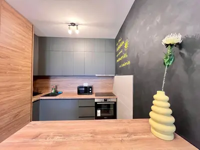 a kitchen with a vase with a flower in it at White Homes 105 - Central Point in Podgorica