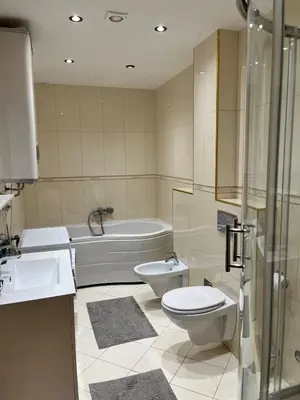 a bathroom with a toilet and a sink and a tub at Blue lagoon apartment Przno in Budva