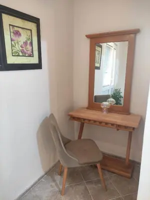 a mirror and a chair in a room at Green Valley GV in Kotor